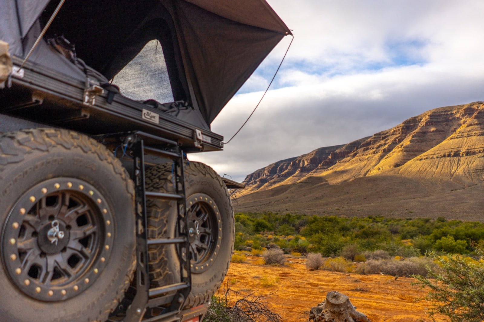 Bushtech canopy with twin spare carriers against Karoo cliffs
