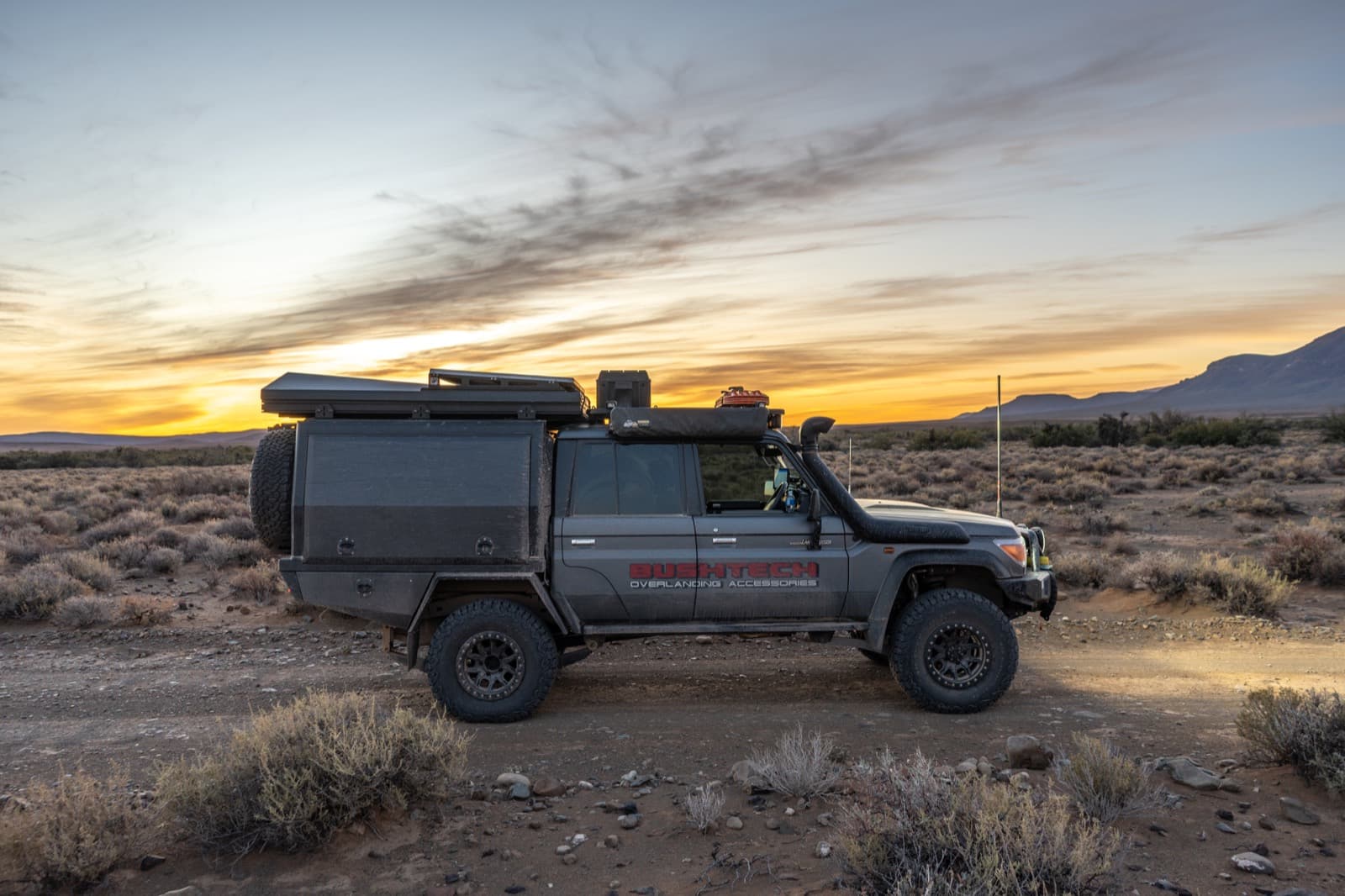 A Bushtech tray canopy on a Land Cruiser 79 at sunset in the Karoo