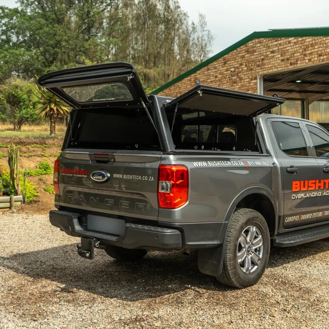 A Ford Ranger with a Bushtech canopy, both gullwings open