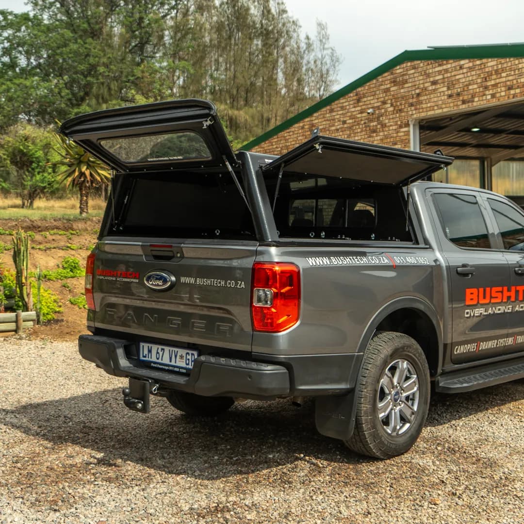 A Ford Ranger with a Bushtech canopy, both gullwings open