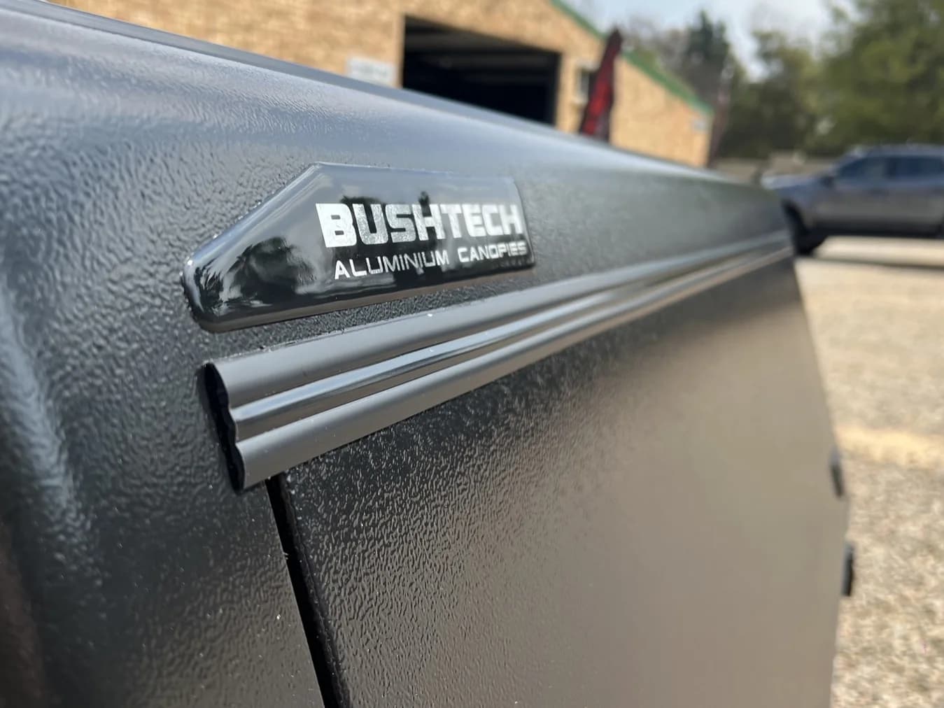 A seamless welded corner and the serial badge on the powder coat