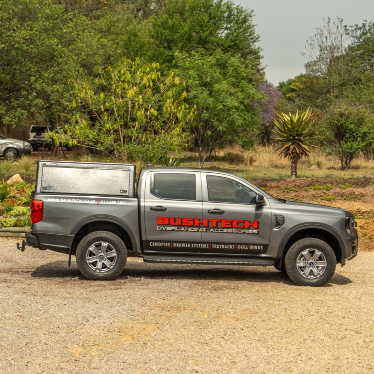 A Ford Ranger with a Bushtech canopy, from the side