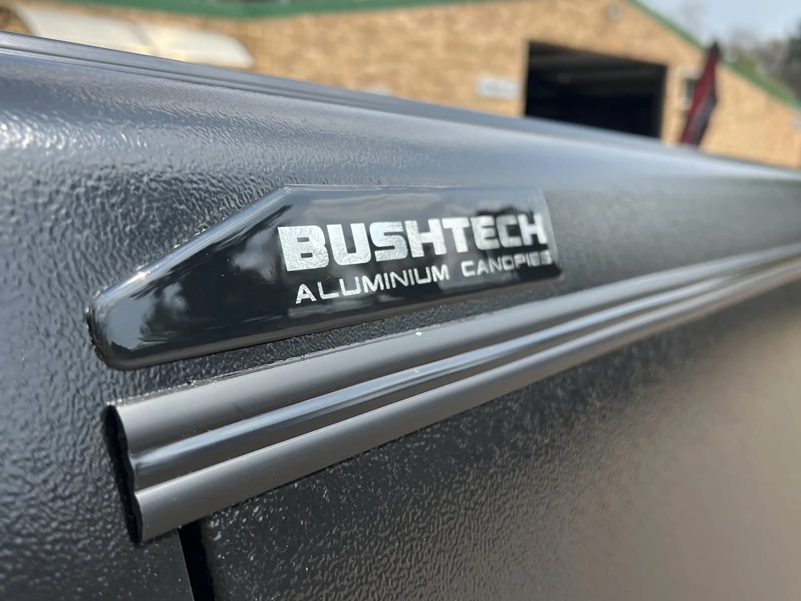 The badge and the powder-coat finish, close